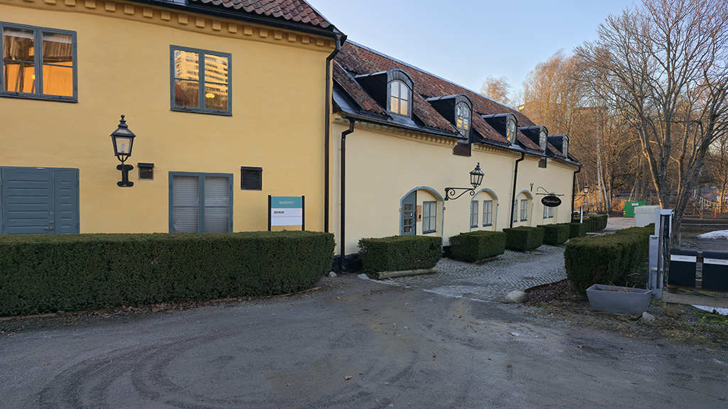 Two old buildings with yellow painted walls