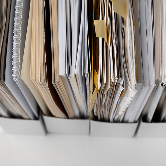 Serveral documents and pieces of paper inside four folders